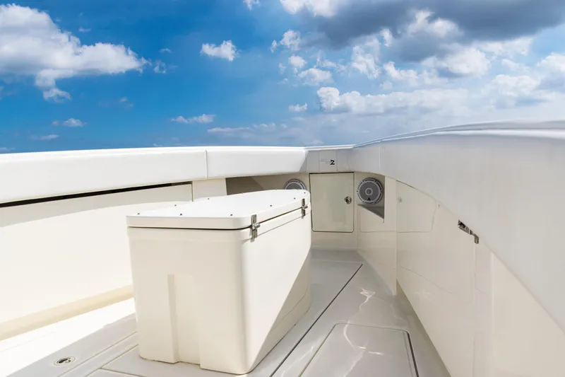 Slide: The Image of 2018 SeaVee 370Z boat deck with storage compartment under a clear blue sky. - 14
