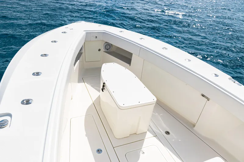 Slide: The Image of 2018 SeaVee 370Z boat deck with storage, surrounded by ocean waters. - 17