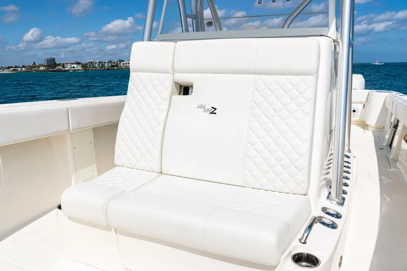 Slide: The Image of 2018 SeaVee 370Z boat with white seating, ocean backdrop, and clear skies. - 20