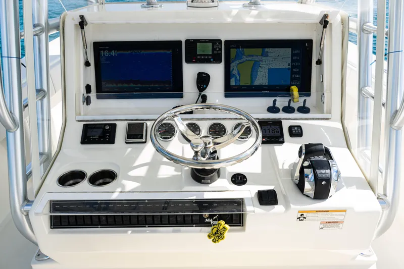 Slide: The Image of 2018 SeaVee 370Z boat dashboard with navigation screens and controls. - 24