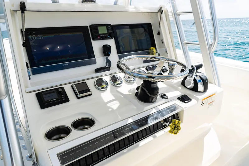 Slide: The Image of Control panel of a 2018 SeaVee 370Z boat with navigation equipment. - 26