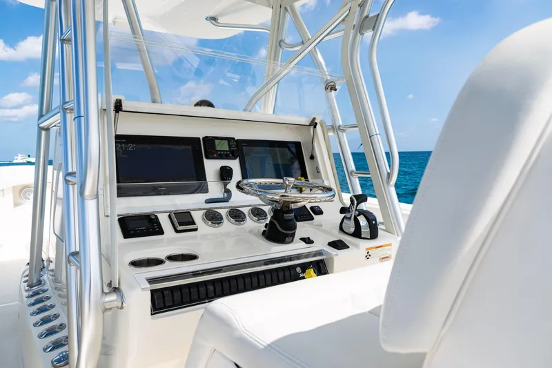 Slide: The Image of 2018 SeaVee 370Z boat helm with modern controls and ocean view. - 28