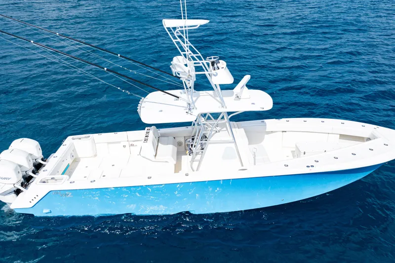 Slide: The Image of 2018 SeaVee 370Z boat on open ocean, featuring multiple fishing rods. - 3