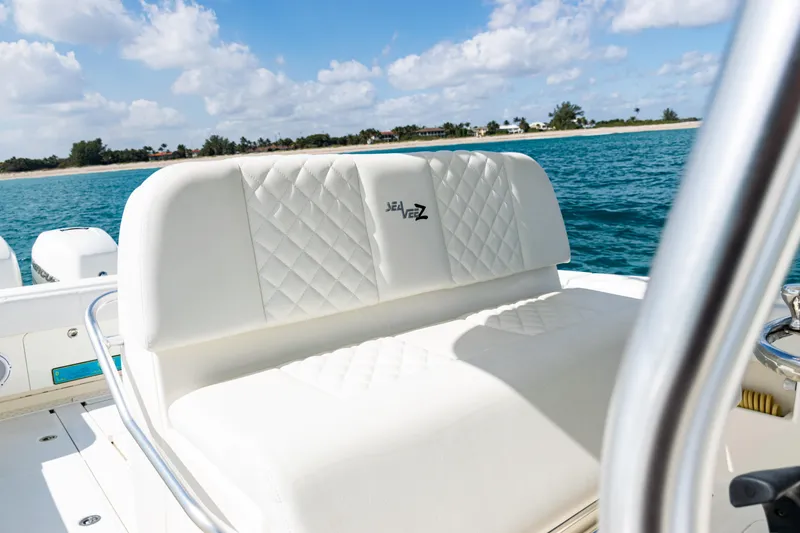Slide: The Image of 2018 SeaVee 370Z boat with white seating, ocean view, and clear sky. - 30