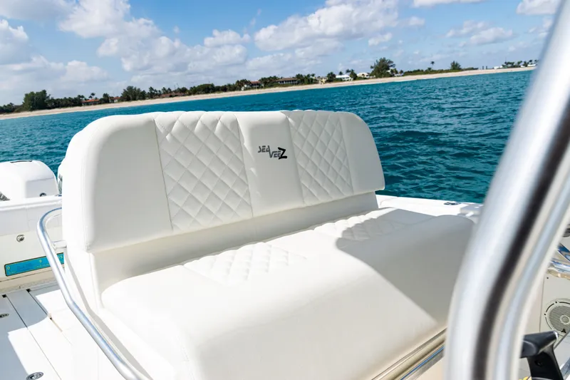 Slide: The Image of 2018 SeaVee 370Z boat with white cushioned seating, ocean backdrop. - 32
