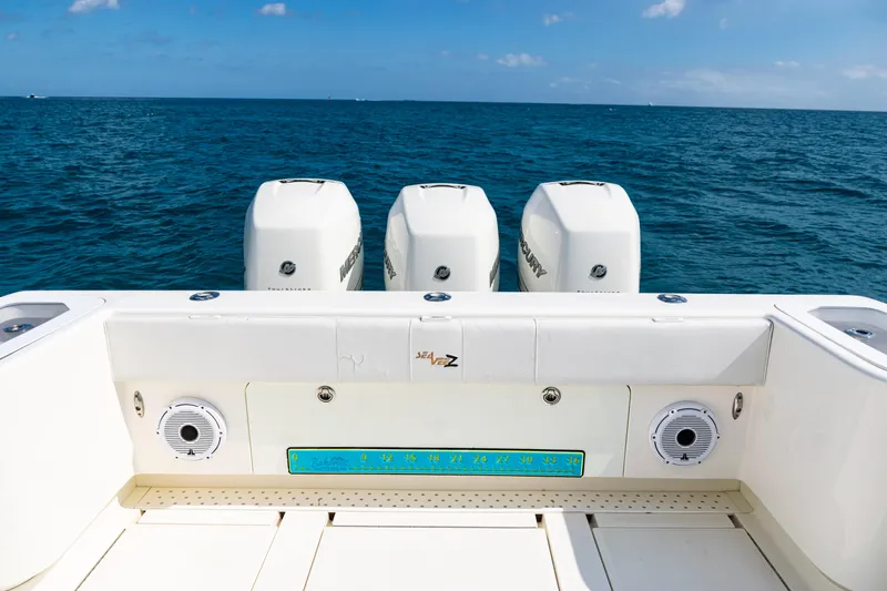 Slide: The Image of 2018 SeaVee 370Z boat with triple Mercury engines on open ocean. - 37