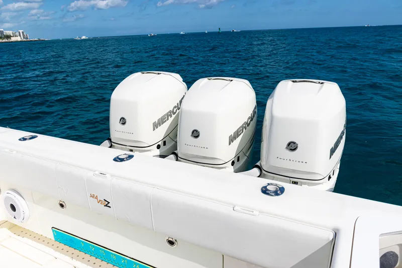 Slide: The Image of 2018 SeaVee 370Z boat with triple Mercury outboard engines on open ocean. - 38