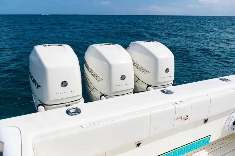 Slide: The Image of 2018 SeaVee 370Z boat with triple Mercury FourStroke engines on open water. - 39