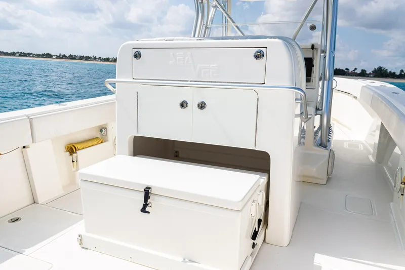 Slide: The Image of 2018 SeaVee 370Z boat interior with storage compartments, ocean view in background. - 41