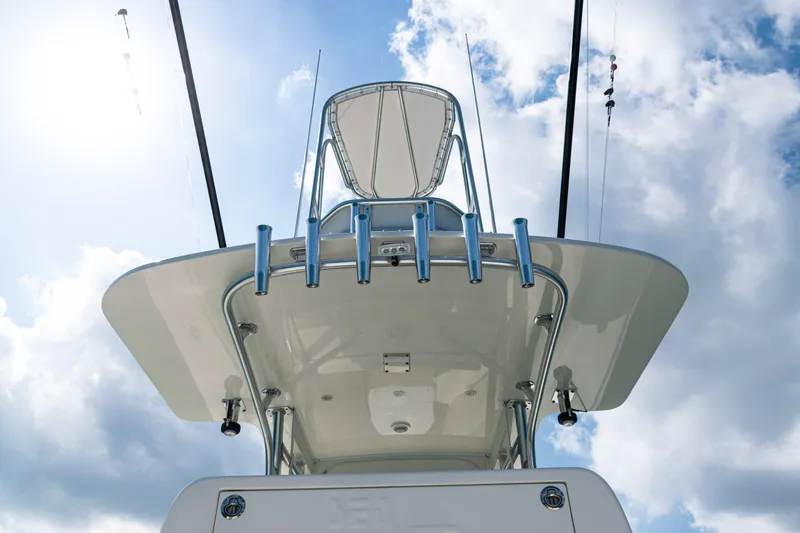 Slide: The Image of 2018 SeaVee 370Z boat with fishing rods against a cloudy sky backdrop. - 42