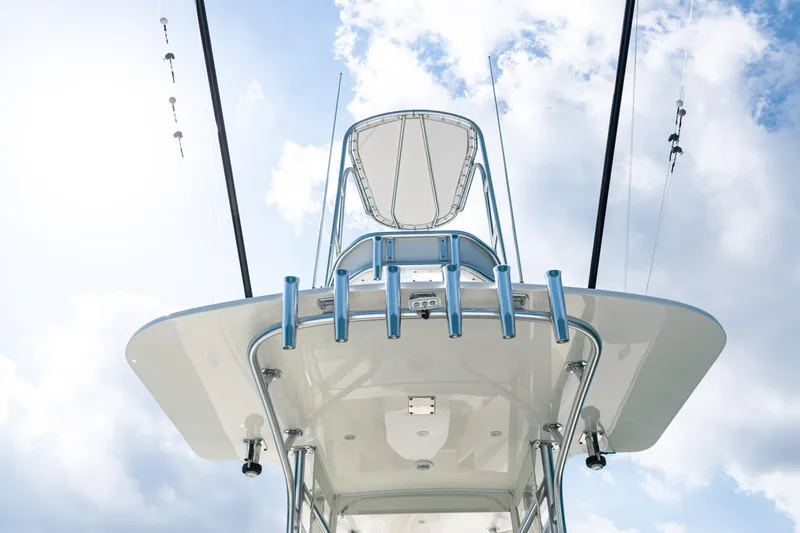 Slide: The Image of 2018 SeaVee 370Z boat tower against a bright, cloudy sky. - 43