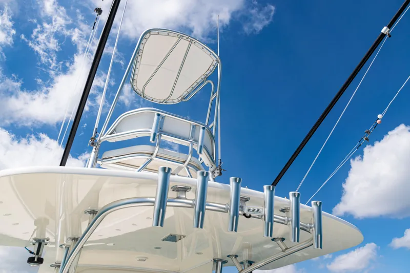 Slide: The Image of 2018 SeaVee 370Z boat tower against a bright blue sky with clouds. - 45