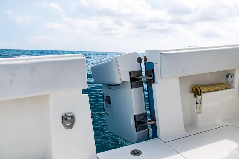 Slide: The Image of 2018 SeaVee 370Z boat with open transom door, ocean view in background. - 46