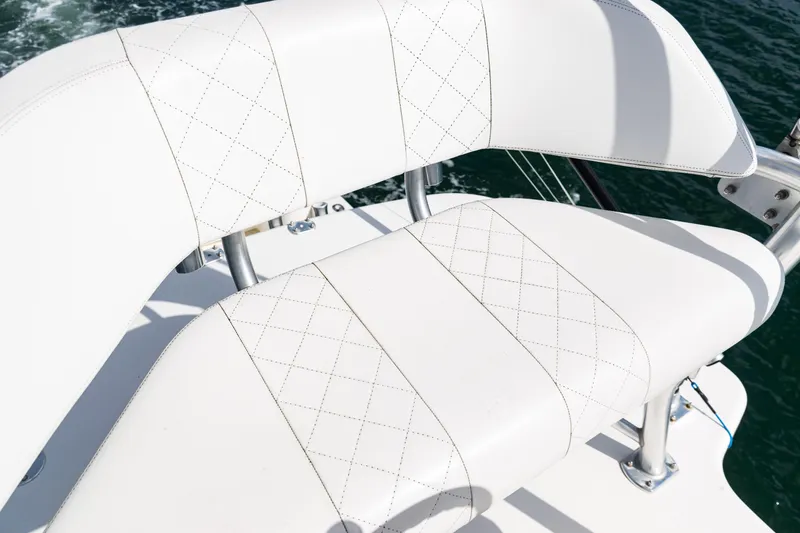 Slide: The Image of White leather seating on 2018 SeaVee 370Z boat, featuring diamond stitching. - 52