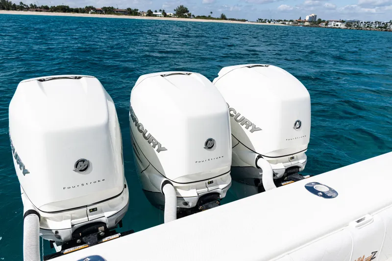 Slide: The Image of Three Mercury FourStroke engines on a 2018 SeaVee 370Z boat in open water. - 58