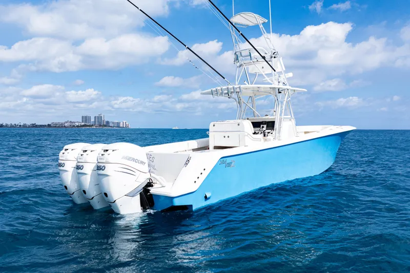 Slide: The Image of 2018 SeaVee 370Z boat with triple Mercury engines on open ocean. - 6