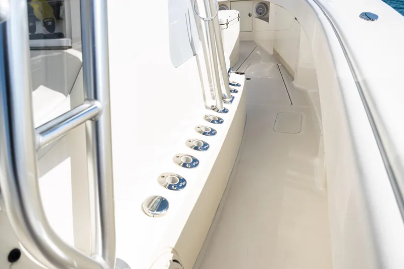 Slide: The Image of 2018 SeaVee 370Z boat deck with rod holders and stainless steel railing. - 60