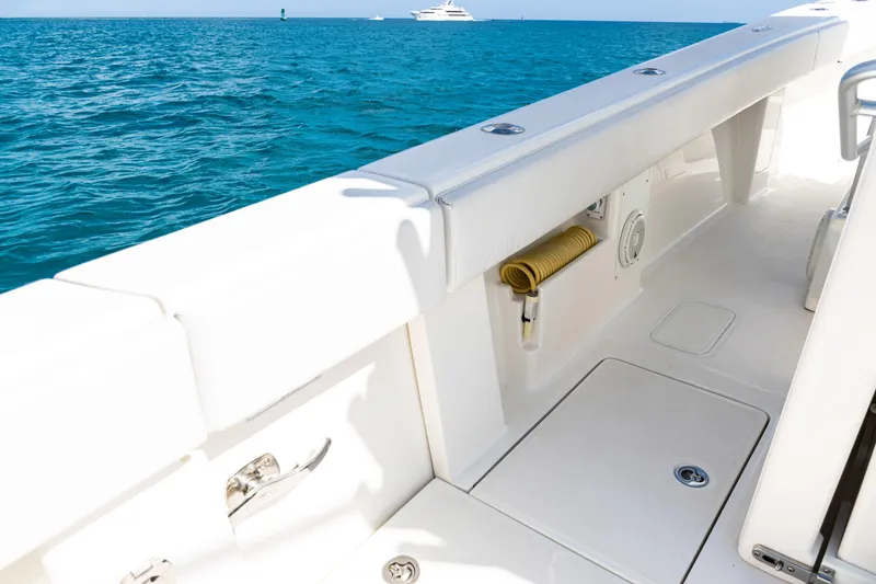 Slide: The Image of 2018 SeaVee 370Z boat deck with ocean view, featuring clean white surfaces. - 65