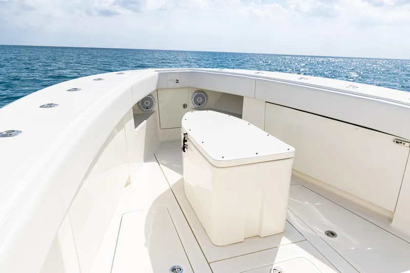 Slide: The Image of 2018 SeaVee 370Z boat deck with ocean view, featuring sleek white design. - 8