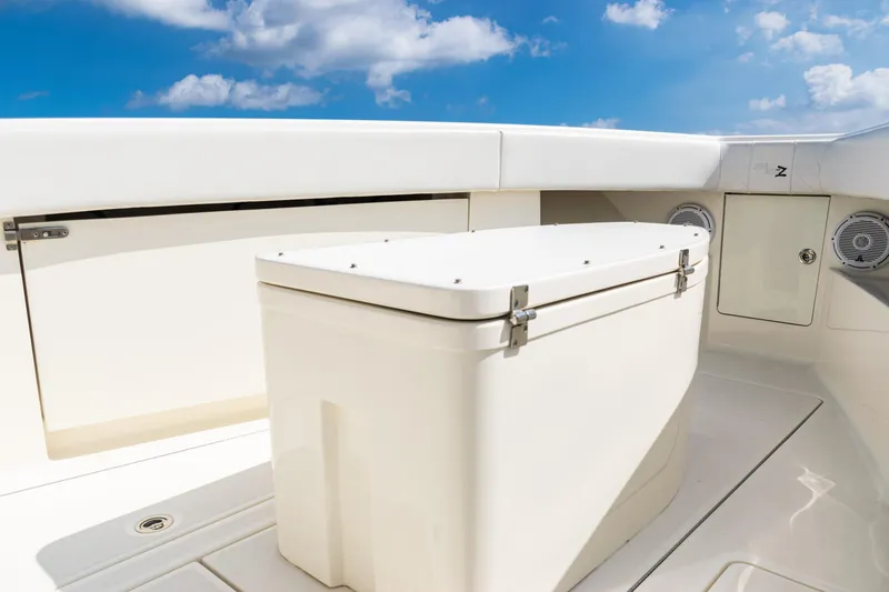 Slide: The Image of 2018 SeaVee 370Z boat deck with storage compartment under a clear blue sky. - 9
