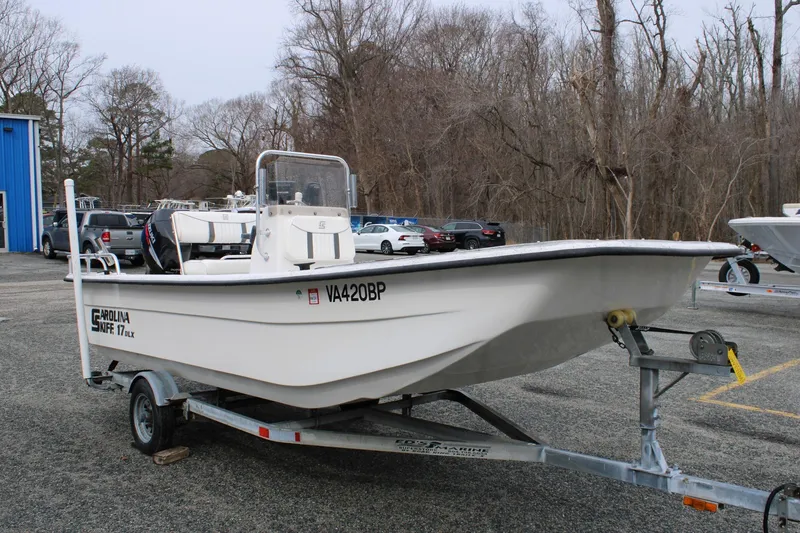 Slide: The Image of 2009 Carolina Skiff 17 DLX boat on trailer in parking lot. - 1
