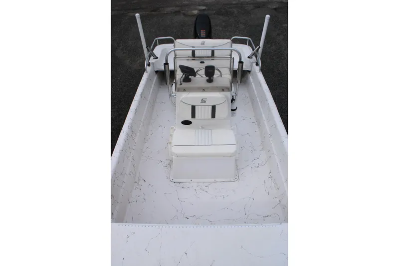 Slide: The Image of 2009 Carolina Skiff 17 DLX boat interior with seating and steering console. - 13