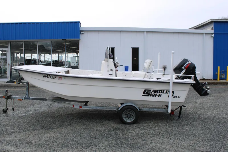 Slide: The Image of 2009 Carolina Skiff 17 DLX boat on trailer, parked outside dealership. - 4