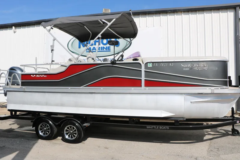 The Image of 2019 SunCatcher V322 RC pontoon boat on trailer, parked outside Nichols Marine. - 1