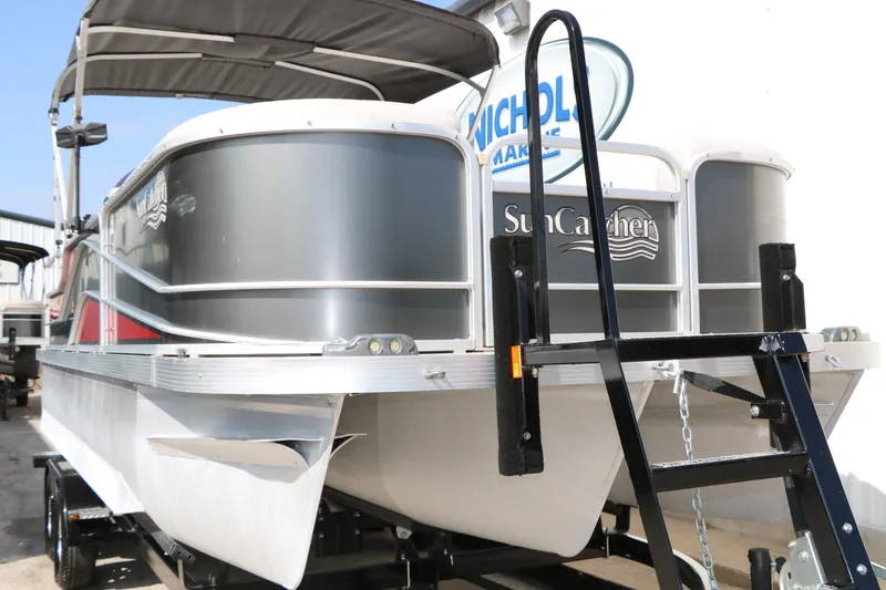 Slide: The Image of 2019 SunCatcher V322 RC pontoon boat with canopy and trailer, front view. - 4