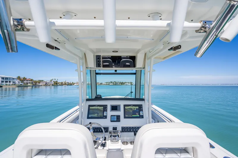 Slide: The Image of 2013 Boston Whaler 320 Outrage boat dashboard with ocean view. - 31
