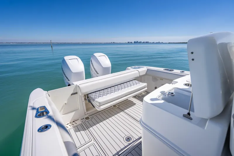 Slide: The Image of 2013 Boston Whaler 320 Outrage boat with dual engines on calm water. - 35