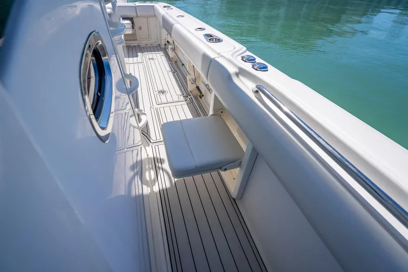 Slide: The Image of 2013 Boston Whaler 320 Outrage boat interior with seating and sleek design. - 47