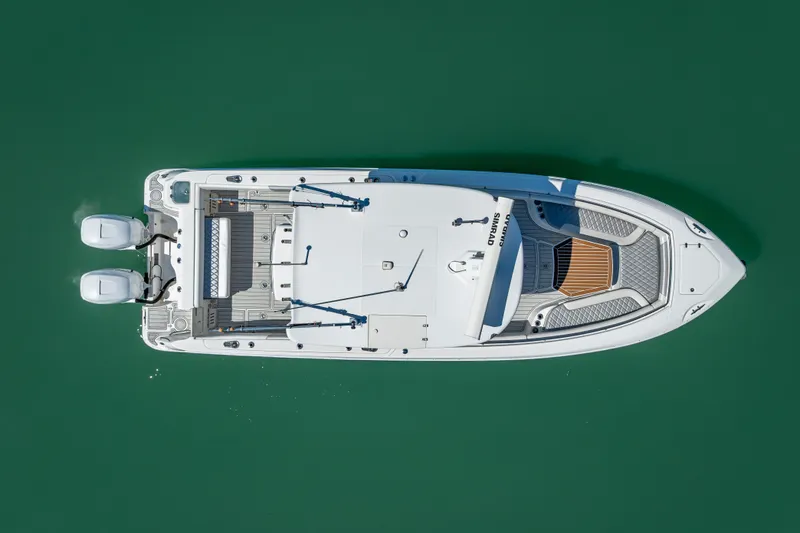 Slide: The Image of Aerial view of 2013 Boston Whaler 320 Outrage boat on green water. - 8
