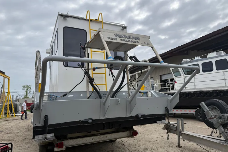 Slide: The Image of Custom Aluminum Work Boat 34x10, 2010 model, docked with visible equipment and ladder. - 5