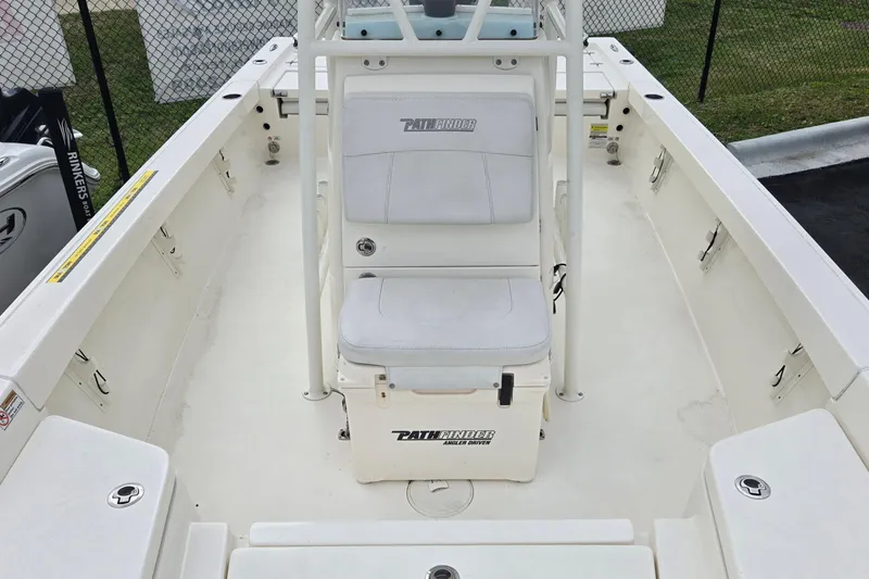 Slide: The Image of 2022 Pathfinder 2400 TRS boat interior with seating and storage compartments. - 10