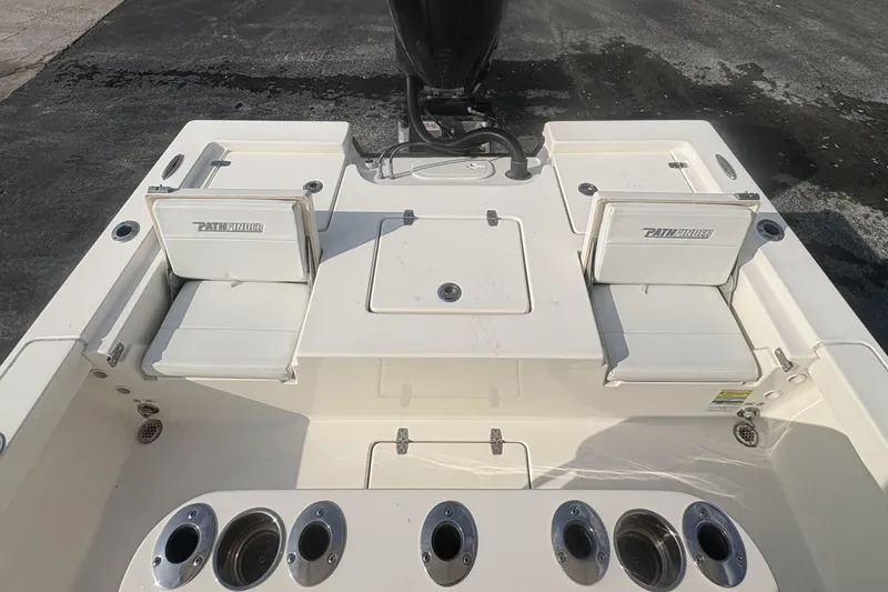 Slide: The Image of 2022 Pathfinder 2400 TRS boat interior with seating and rod holders. - 12