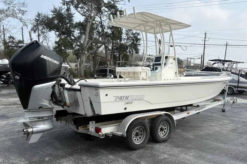 Slide: The Image of 2022 Pathfinder 2400 TRS boat on trailer with Mercury outboard motor. - 3