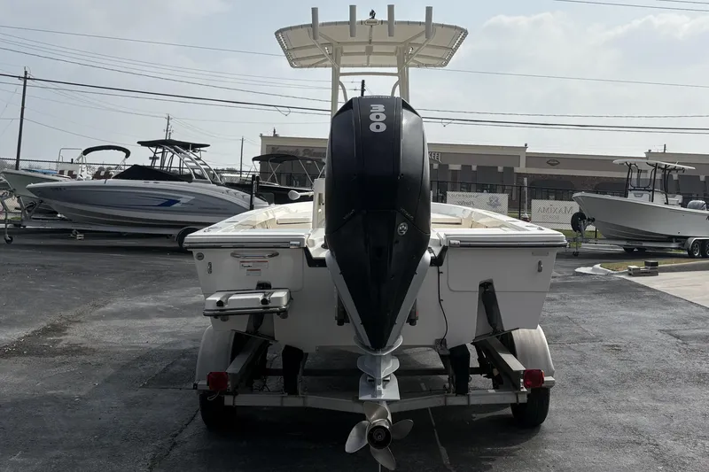 Slide: The Image of 2022 Pathfinder 2400 TRS boat on trailer, rear view with outboard motor. - 4