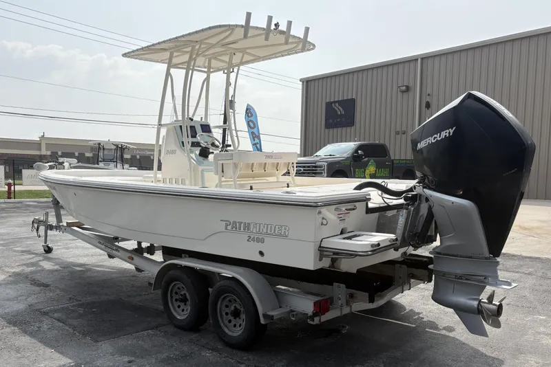 Slide: The Image of 2022 Pathfinder 2400 TRS boat on trailer with Mercury outboard motor. - 5