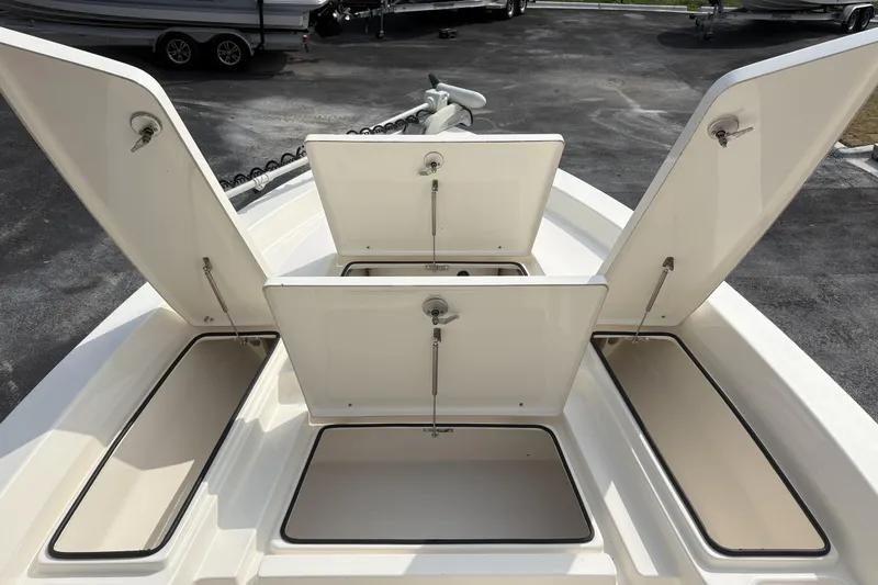Slide: The Image of Open storage compartments on a 2022 Pathfinder 2400 TRS boat deck. - 9