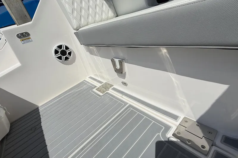 Slide: The Image of 2026 Regal 36 XO boat interior, featuring sleek seating and modern speaker design. - 23