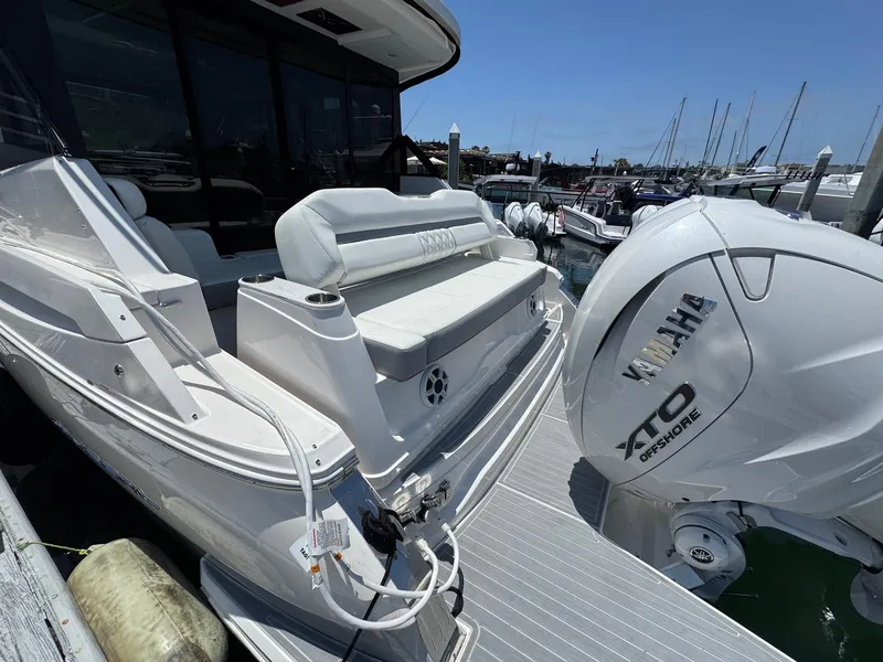 Slide: The Image of 2026 Regal 36 XO boat with Yamaha XTO engine docked at marina. - 28