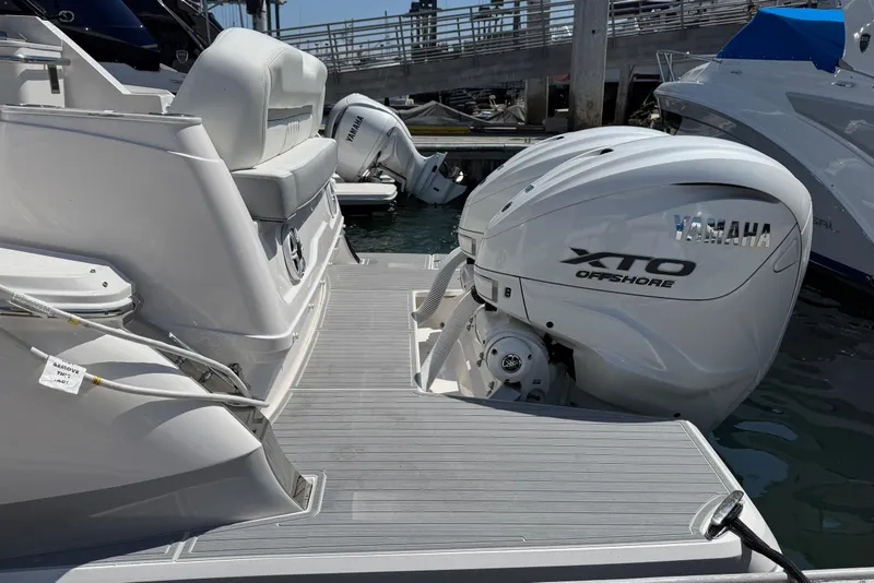 Slide: The Image of 2026 Regal 36 XO boat with Yamaha XTO Offshore engines at dock. - 29