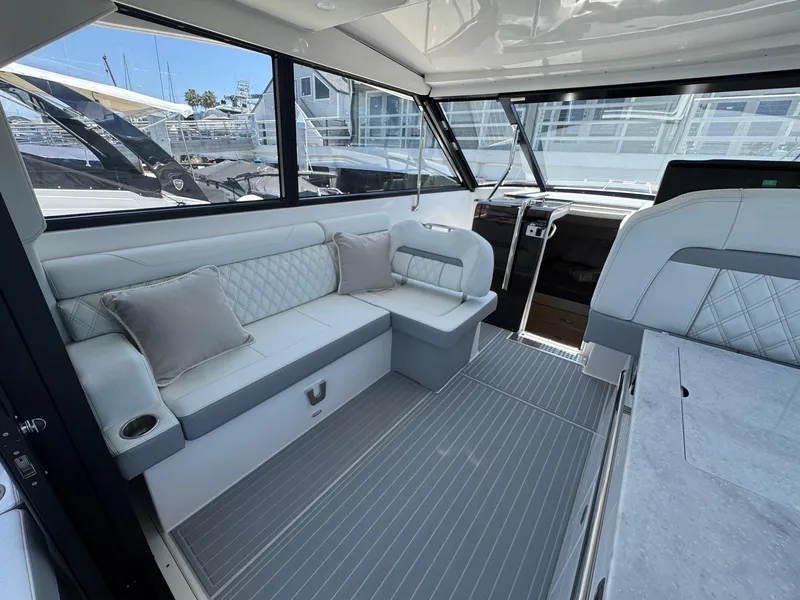 Slide: The Image of Interior of 2026 Regal 36 XO yacht with elegant seating and modern design. - 42