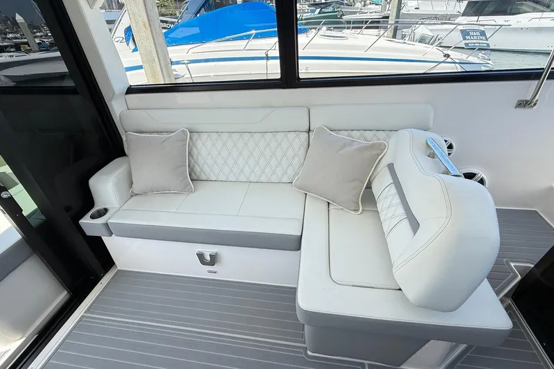 Slide: The Image of Luxurious seating area on 2026 Regal 36 XO yacht with elegant cushions and modern design. - 43