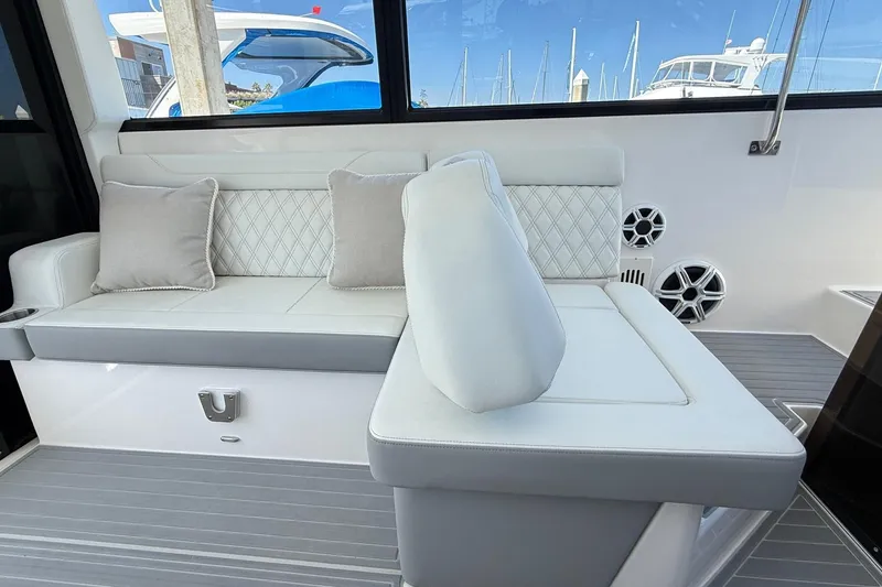 Slide: The Image of Luxurious seating area on the 2026 Regal 36 XO yacht with elegant cushions. - 44