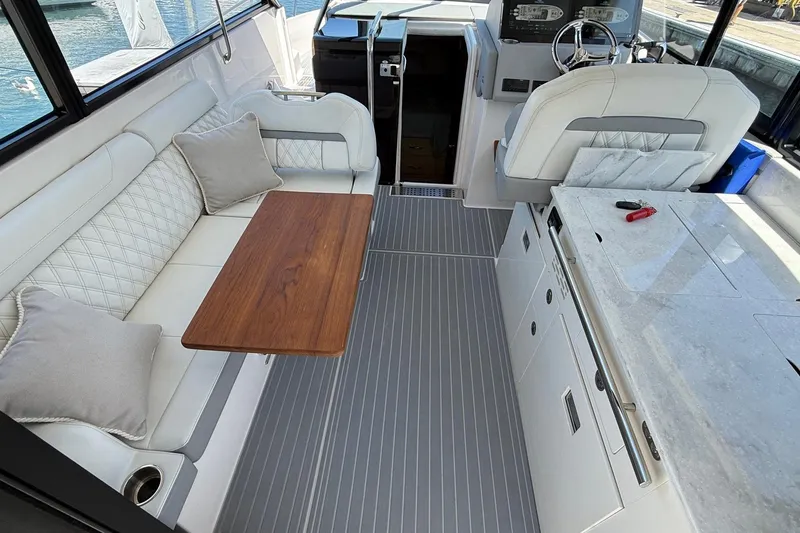 Slide: The Image of Luxurious interior of 2026 Regal 36 XO yacht with elegant seating and modern amenities. - 47