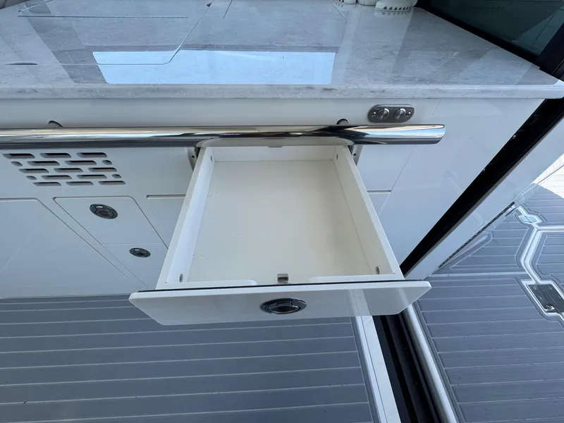 Slide: The Image of Open drawer on 2026 Regal 36 XO yacht, showcasing sleek interior design. - 56