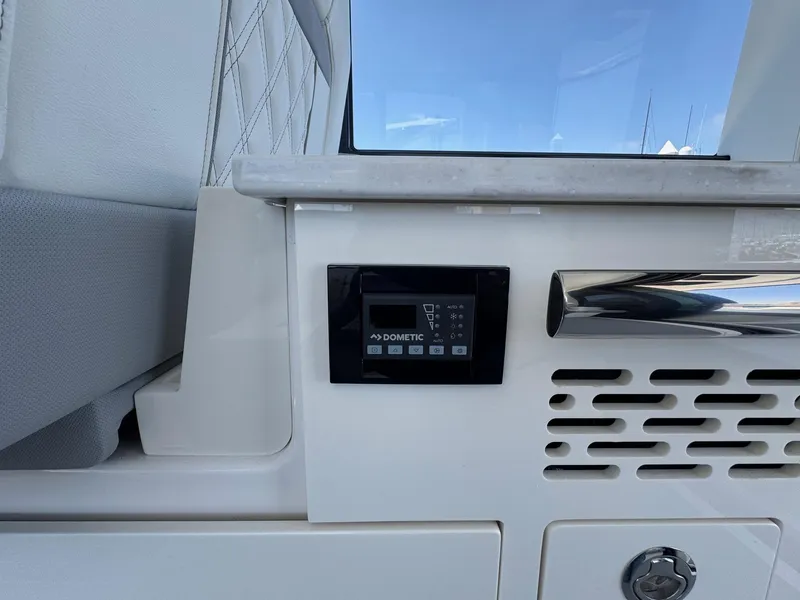 Slide: The Image of Control panel on 2026 Regal 36 XO yacht interior, featuring Dometic system. - 57