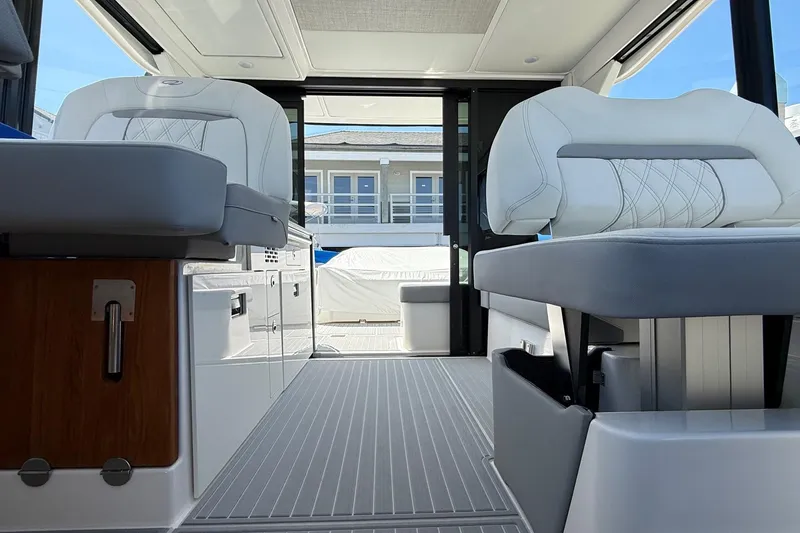 Slide: The Image of Interior of 2026 Regal 36 XO yacht, featuring luxurious seating and modern design. - 65